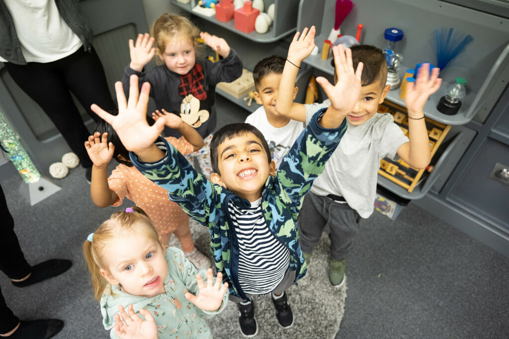 children hands in air